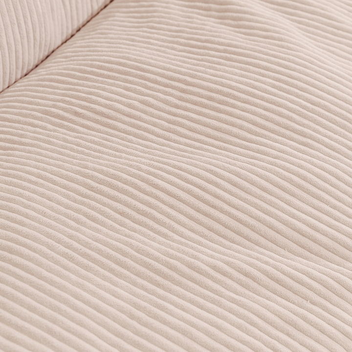 Pouf en velours côtelé épais blanc, gros reliefs côtelé en gros plan